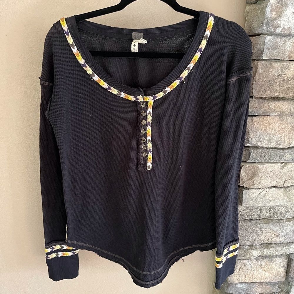 We the free free people top with buttons and decorative braided detail.